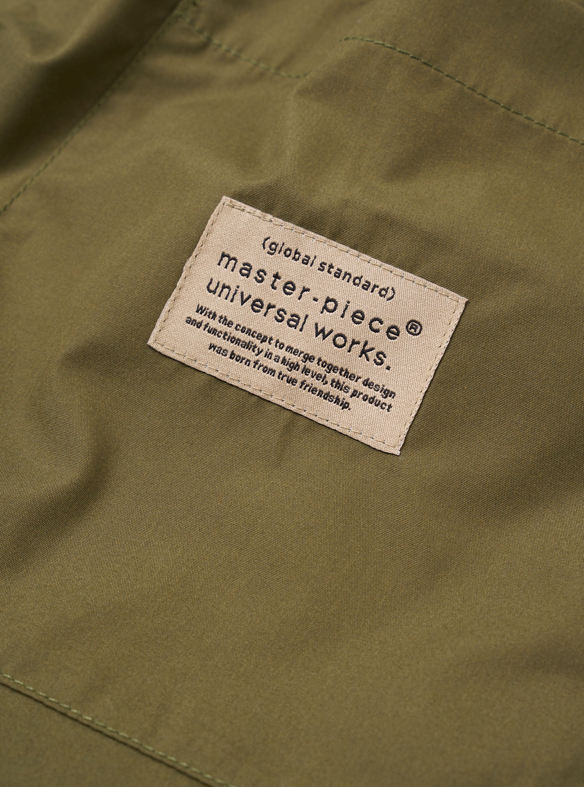 master-piece x Universal Works Olive Recycled Poly Tech Pleated Track Short - Image 7